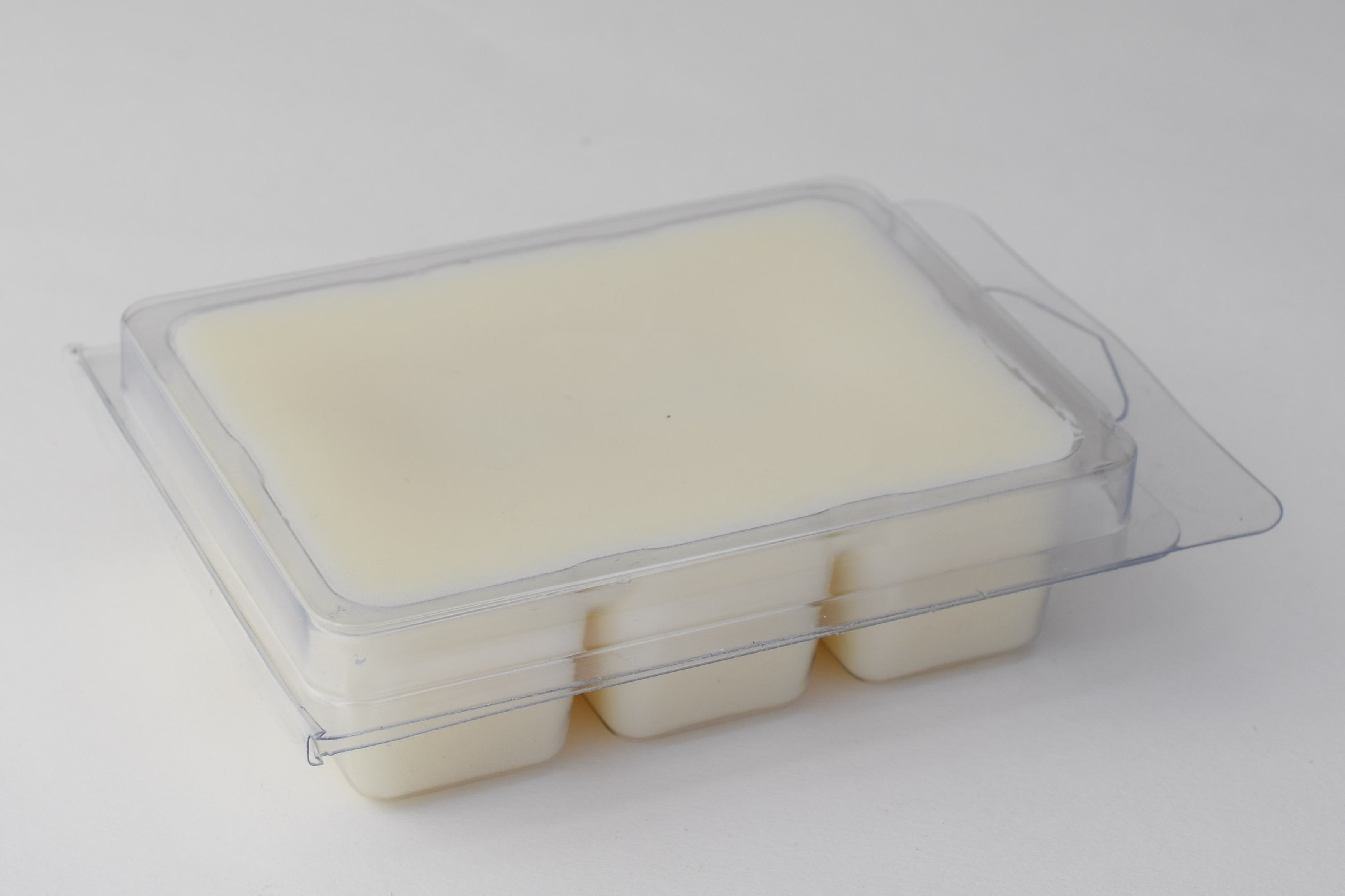 Rectangular wax melt clam shell on a light gray background
